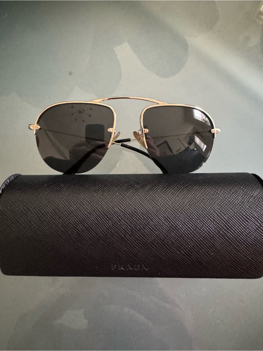 Prada Men’s Black Temples with Gold Accents Rimless Sunglasses - Picture 3 of 7